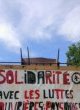 Pancarte «Solidarité avec les luttes ouvrières et paysannes» à un rassemblement dans la Zone à défendre de Notre-Dame-des-Landes.